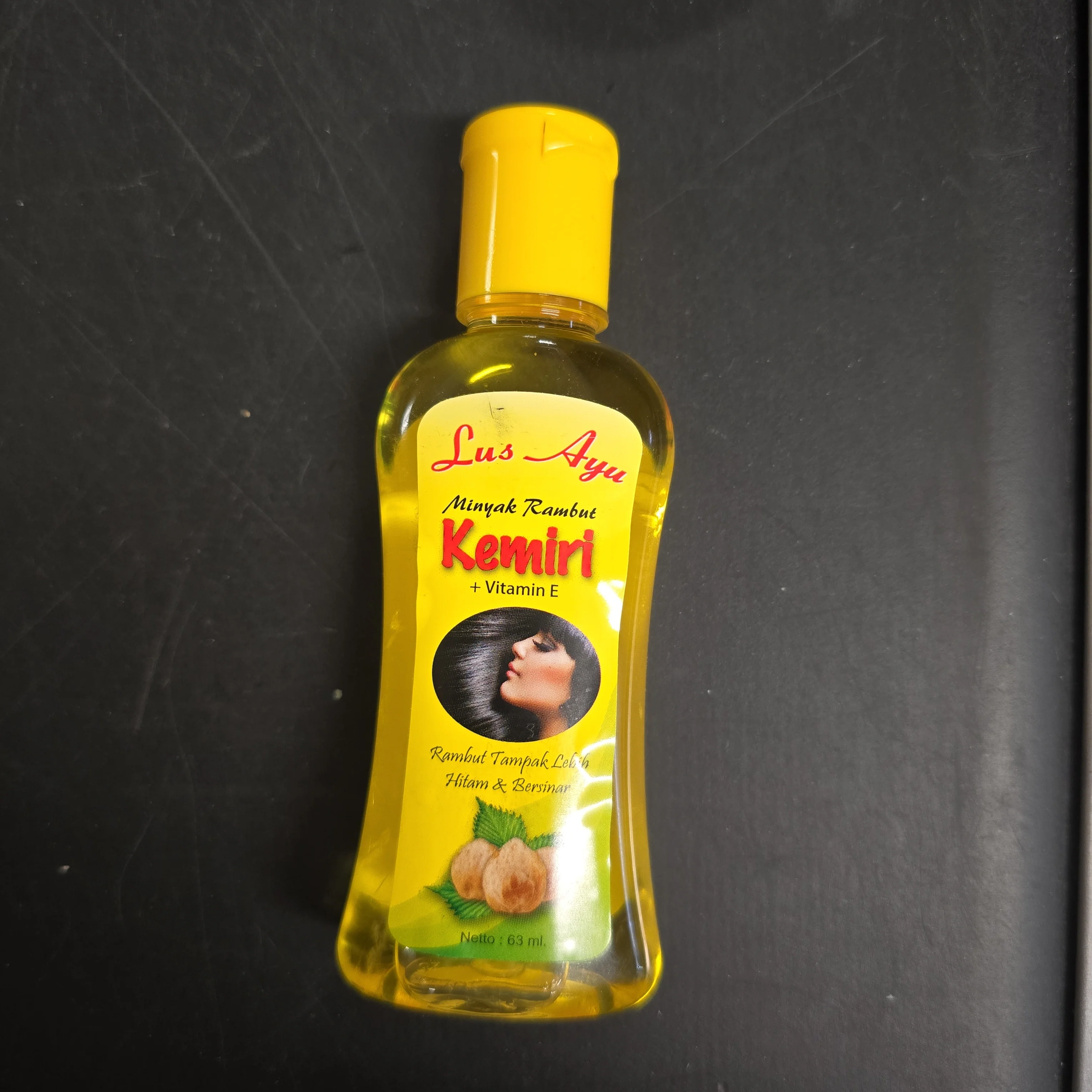 Lus Ayu Minyak Rambut Kemiri 63 ml (Botol Kuning)